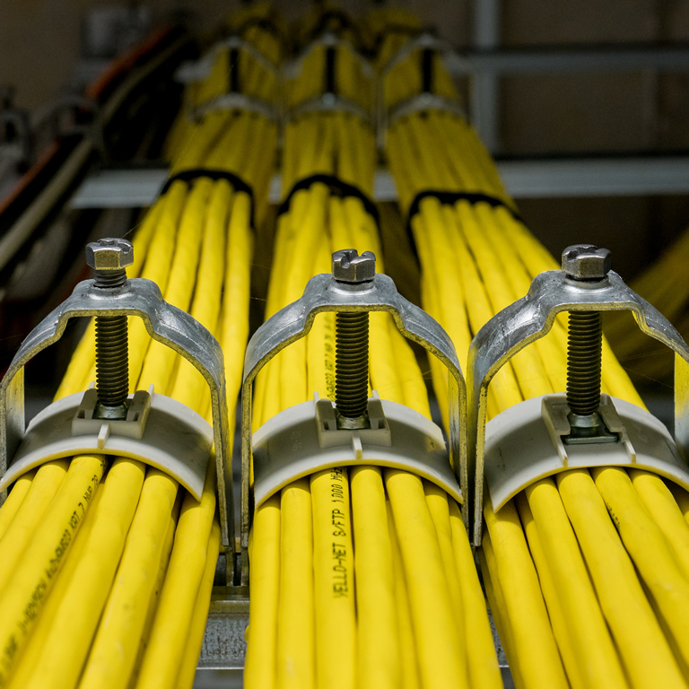 Yellow network cables with assured with cable clips
